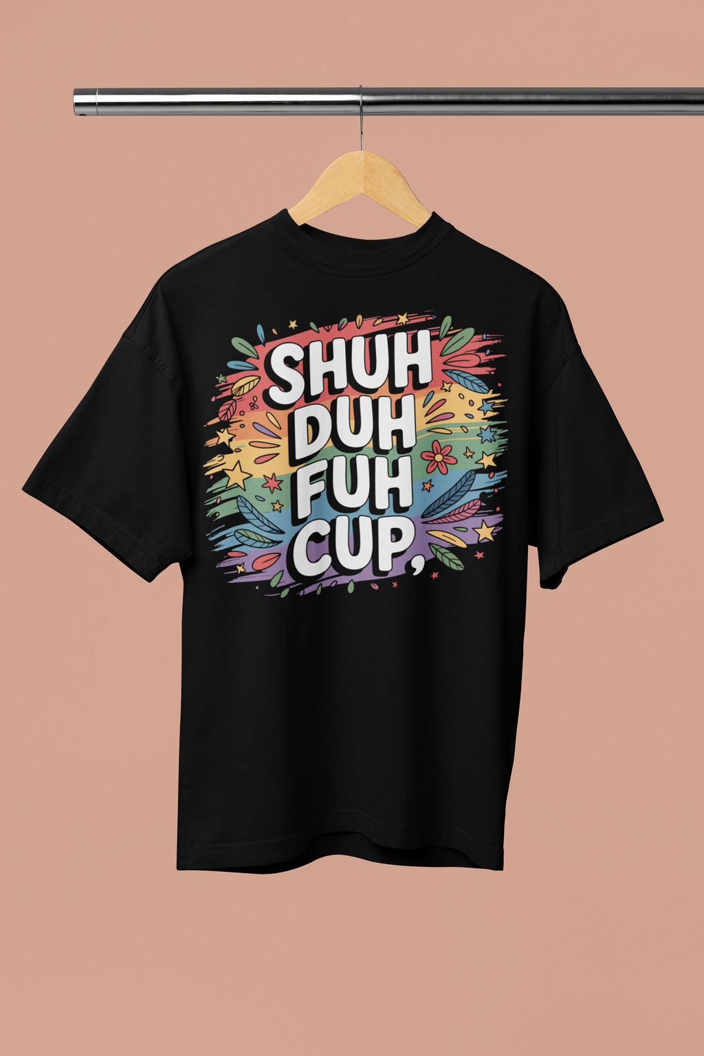 Black t-shirt with colorful text 'SHUH DUH FUH CUP' on a hanger against a beige background